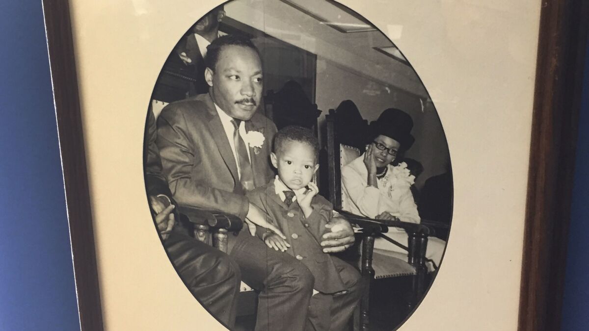 The Rev. Alyn E. Waller has a 1967 photo showing him as a 3-year-old sitting in the Rev. Martin Luther King Jr.'s lap.