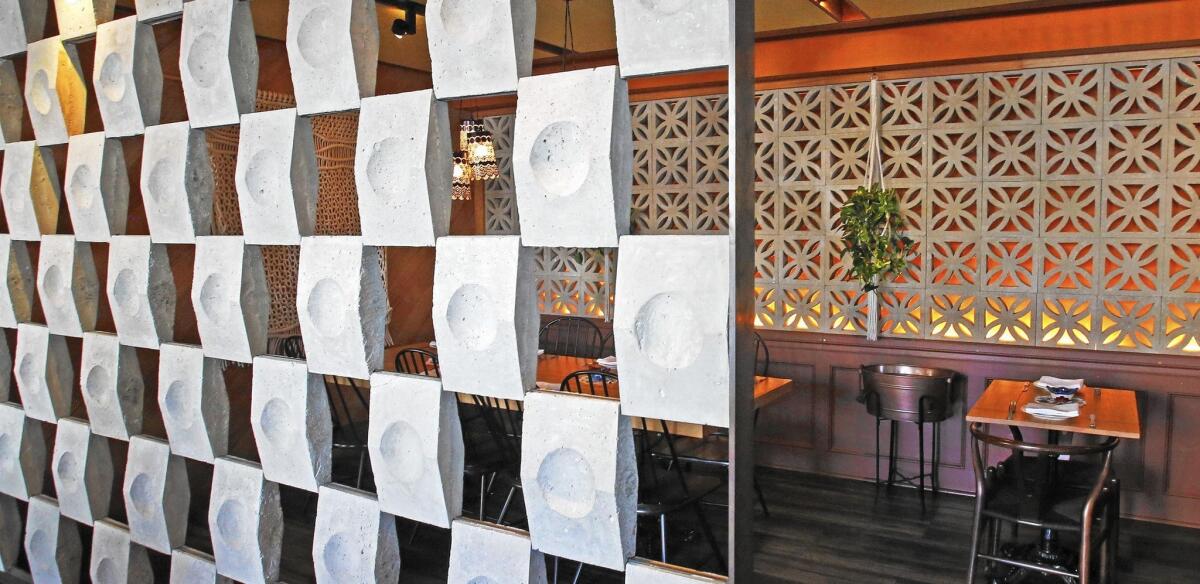 The Broken Spanish restaurant was designed by Barbara Rourke of Bells and Whistles, who says the interior's concrete blocks reference the lines of Maya structures while imparting a “casual, outdoor feel.”