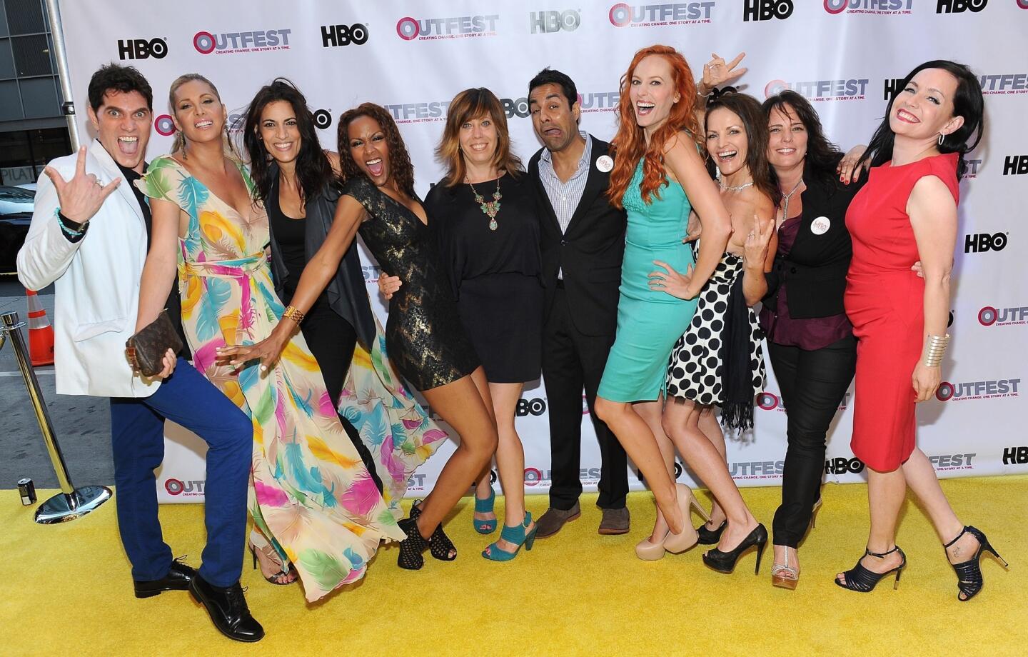 The cast of "Crazy Bitches" with Outfest Executive Director Kirsten Schaffer, center, coordinates a pose at the July 10 opening night gala of "Life Partners" at the Orpheum in downtown Los Angeles.