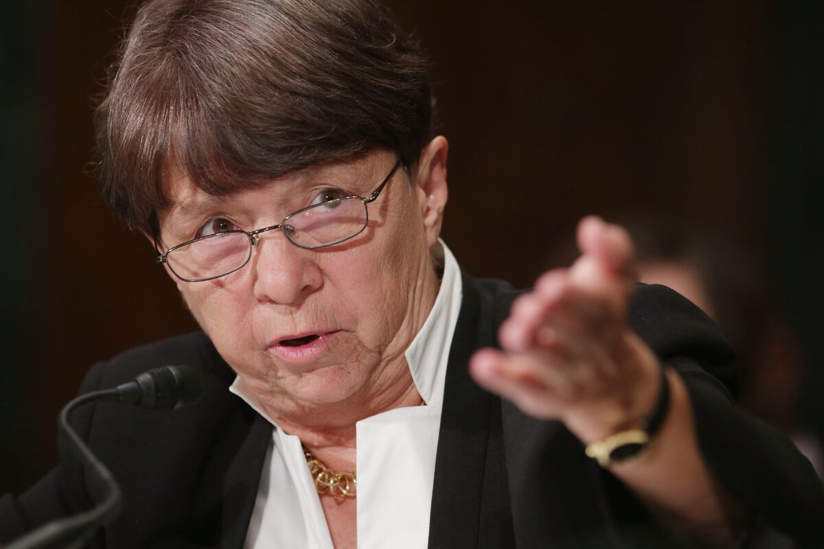 There is no rule at the Securities and Exchange Commission that requires public companies to tell their shareholders what they are up to in partisan elections. Above: SEC chairman Mary Jo White is seen in July.
