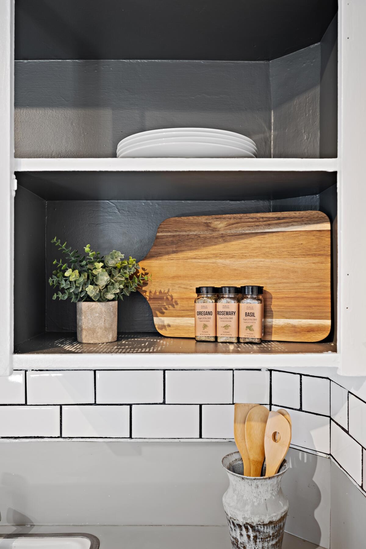 The key is to make a house look homey and lived-in, but not cluttered. Kitchen staged by Guest House.