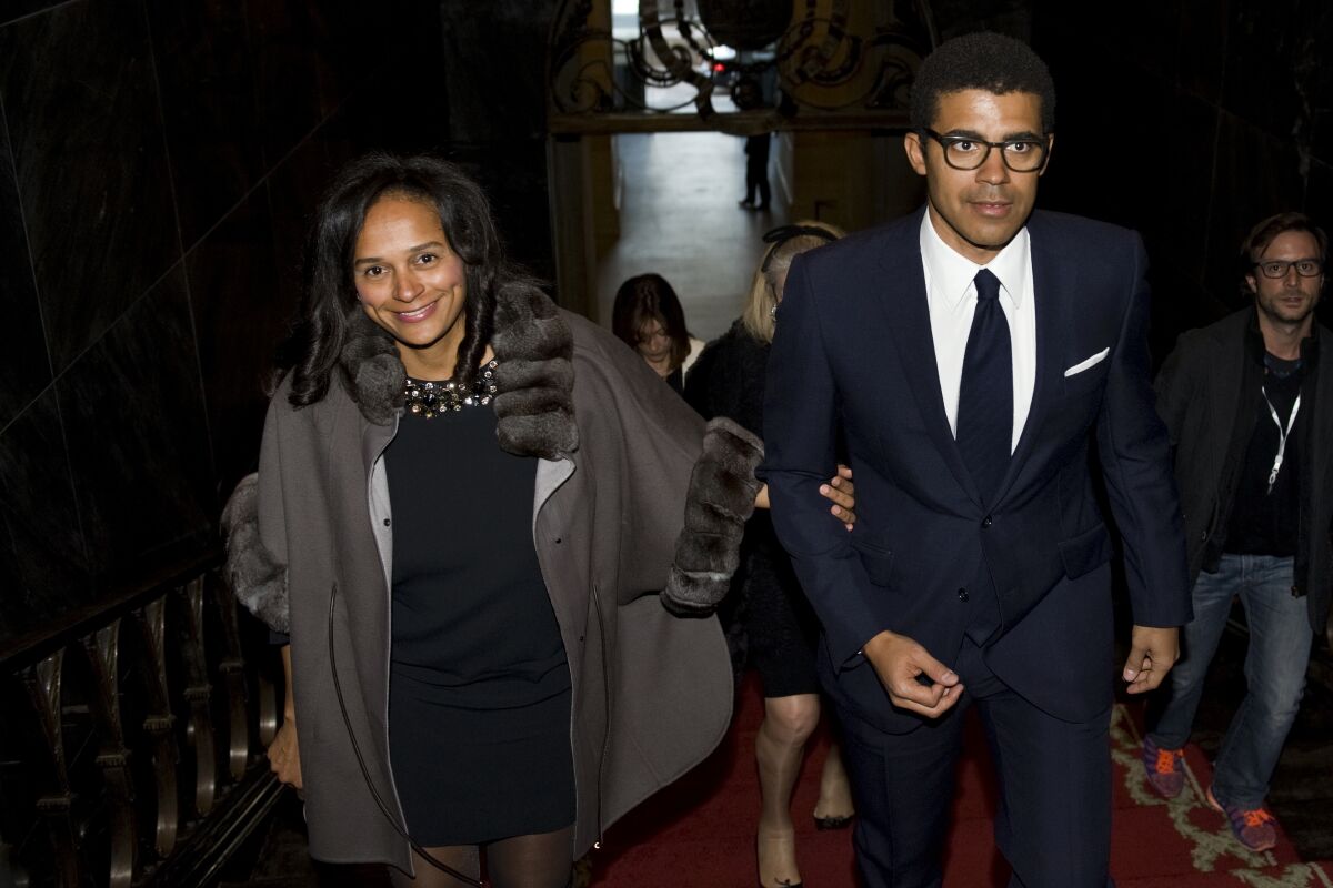 FILE - In this March 5, 2015, file photo, Isabel dos Santos, reportedly Africa's richest woman, and her husband and art collector, Sindika Dokolo, arrive for a ceremony at the City Hall in Porto, Portugal. Police in Dubai said Sunday, Nov. 1, 2020, they don't suspect foul play in the death of Dokolo, the husband of the embattled Angolan billionaire dos Santos, after his death free diving off the city-state as corruption allegations circle both him and his wife. (AP Photo/Paulo Duarte, File)