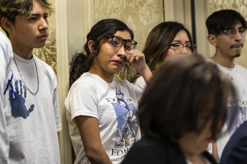 RIVERSIDE, CA - OCTOBER 29, 2019: Jazmin Salcedo, sister of Diego Stolz, 13, wipes tears during a press conference announcing a lawsuit against the Moreno Valley Unified School District for the wrongful death of Stolz who was killed as a result of being bullied at Landmark Middle School on October 29, 2019 in Riverside, California. (Gina Ferazzi/Los AngelesTimes)