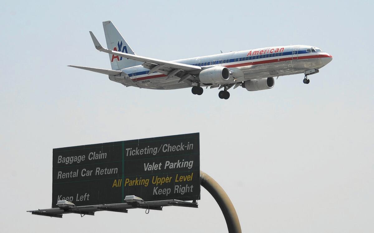 An American Airlines flight prepares to land at John Wayne Airport.