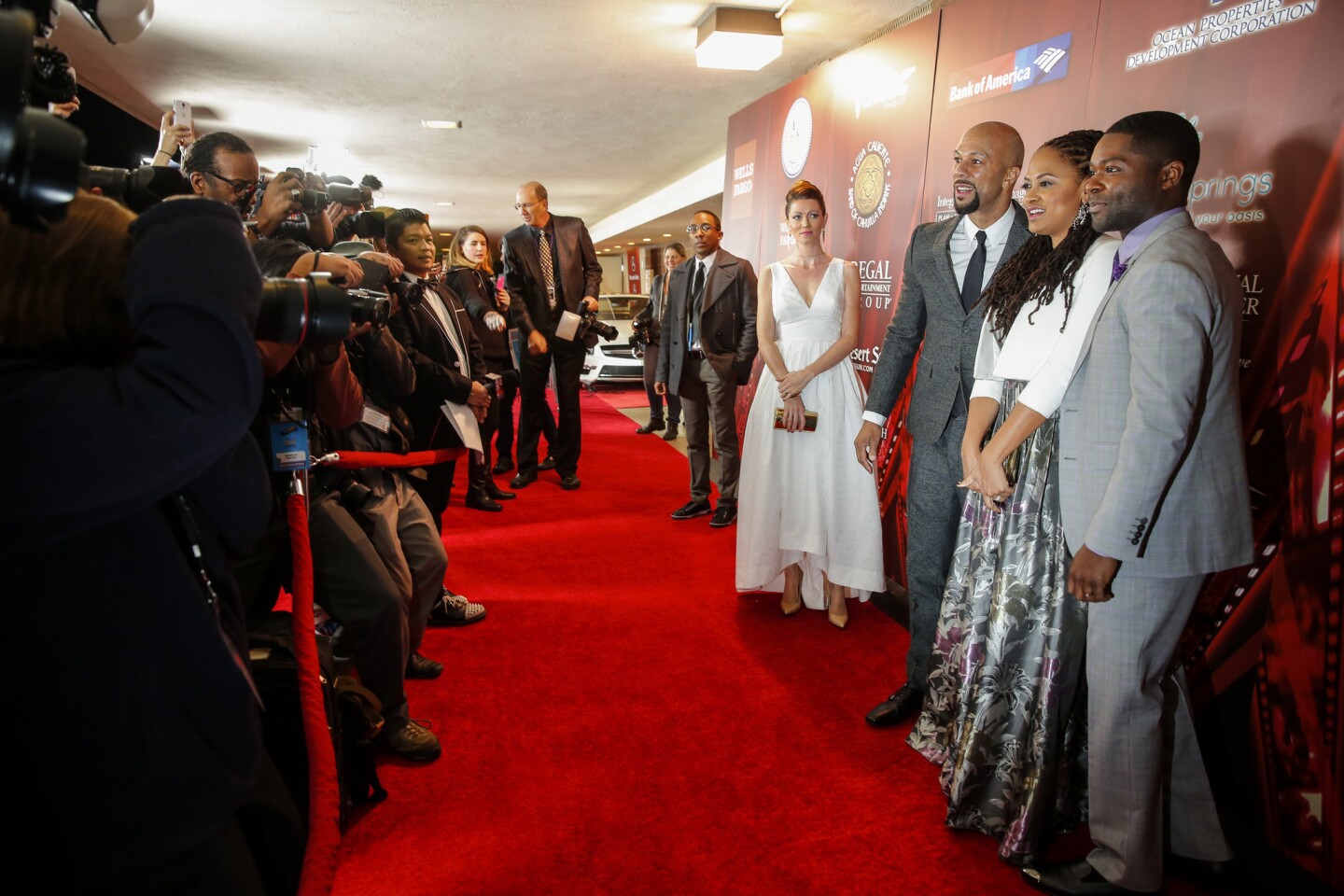 Director Ava DuVernay is surrounded by Common, left, and David Oyelowo on the red carpet for the premiere of "Selma" on opening night of the Palm Springs Film Festival. Oyelowo's wife, Jessica, is at left.