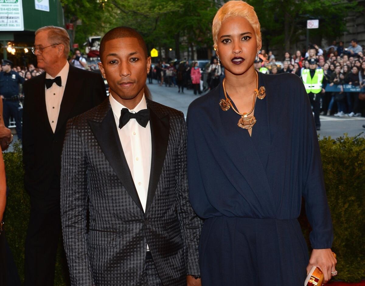 Pharrell Williams and Helen Lasichanh attend the Costume Institute Gala for the "PUNK: Chaos to Couture" exhibition at the Metropolitan Museum of Art in New York.