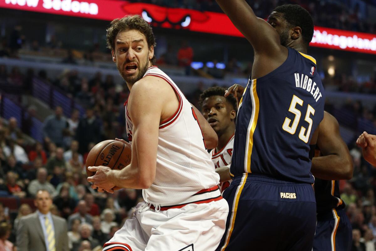 Chicago Bulls forward Pau Gasol, left, drives past Indiana Pacers center Roy Hibbert on Nov. 15. Gasol has been named the recipient of the 2014-15 Magic Johnson Award for excellence on and off the court.