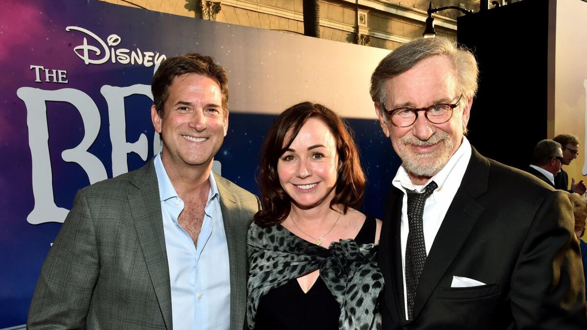 Amblin CEO Michael Wright, left, is stepping down. He is shown with "The BFG" executive producer Kristie Macosko Krieger and director Steven Spielberg.