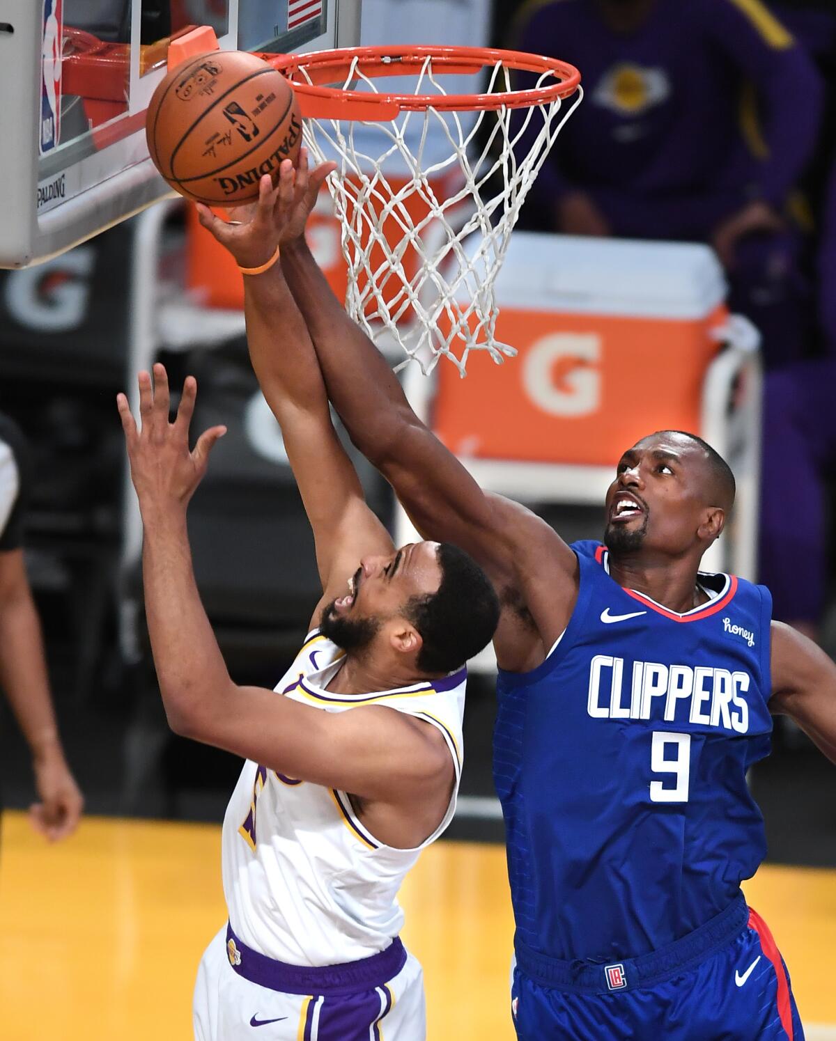 Clippers center Serge Ibaka blocks a shot by Lakers guard Talen Horton-Tucker.