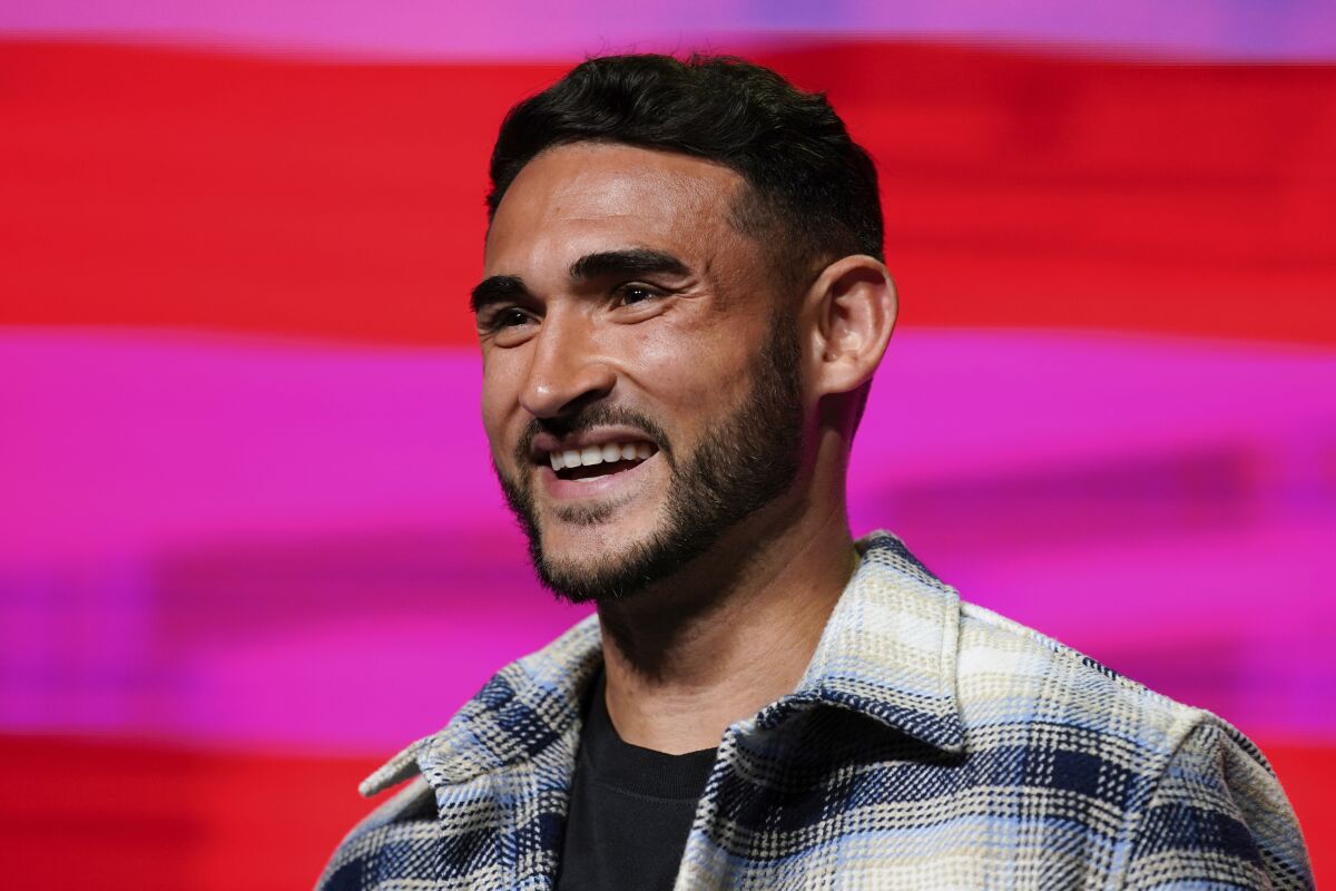 FILE - Cristian Roldan smiles after being announced as a midfielder on the U.S. men's soccer team for the upcoming World Cup in Qatar, Nov. 9, 2022, in New York. The Seattle Sounders will become the first team from the United States and Major League Soccer to participate in the Club World Cup. Seattle won the CONCACAF Champions League last May to earn its spot in the tournament in Morocco. (AP Photo/Julia Nikhinson, File)