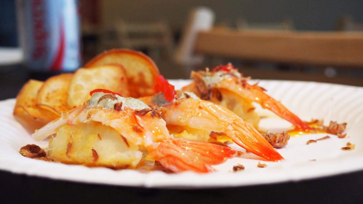 An order of shrimp causa includes three pieces of amaebi shrimp, Peruvian potato salad, shiso pesto, leche de tigre and scallions.
