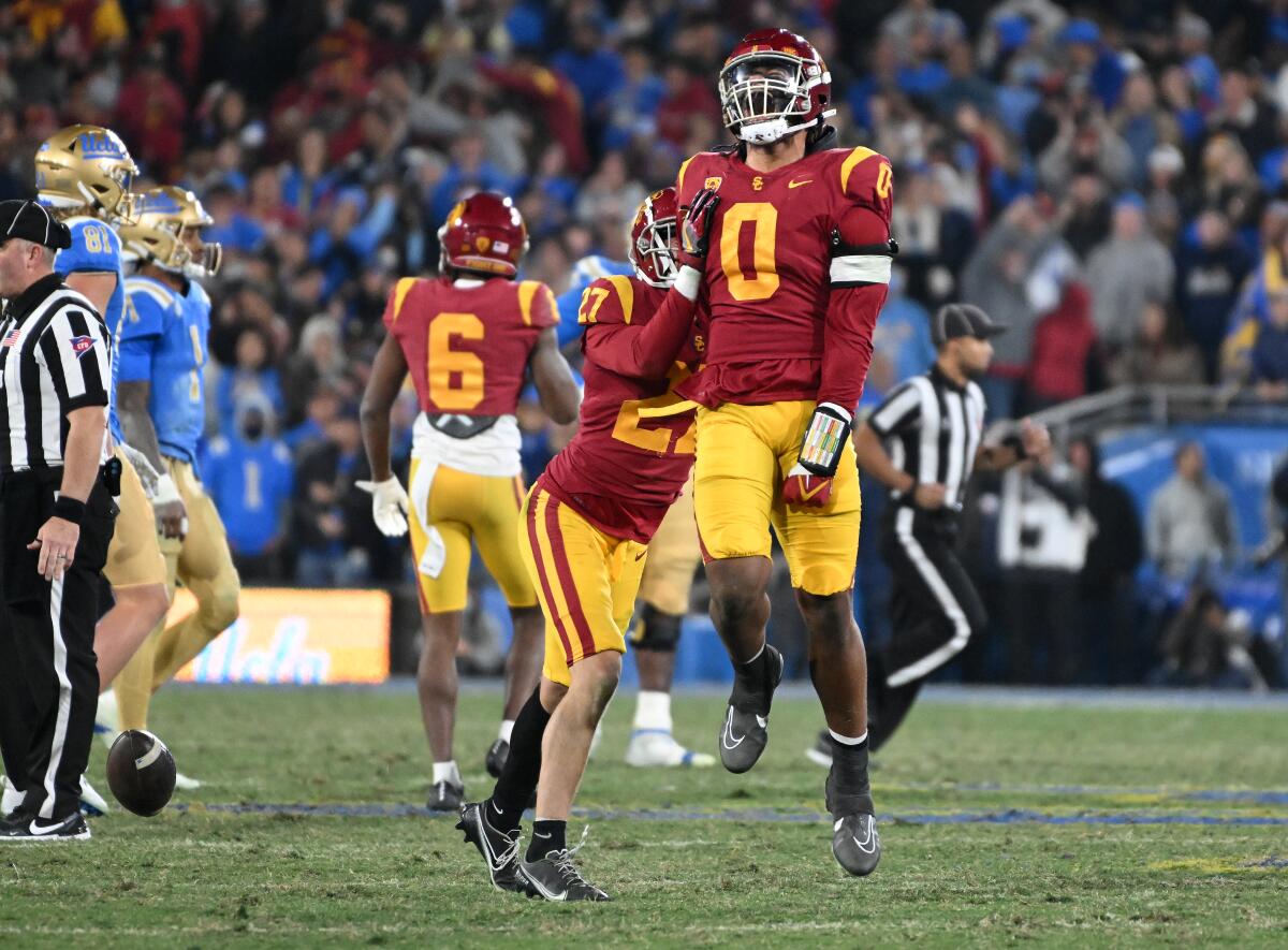 USC’s Korey Foreman celebrates after intercepting a pass from UCLA quarterback Dorian Thompson-Robinson.
