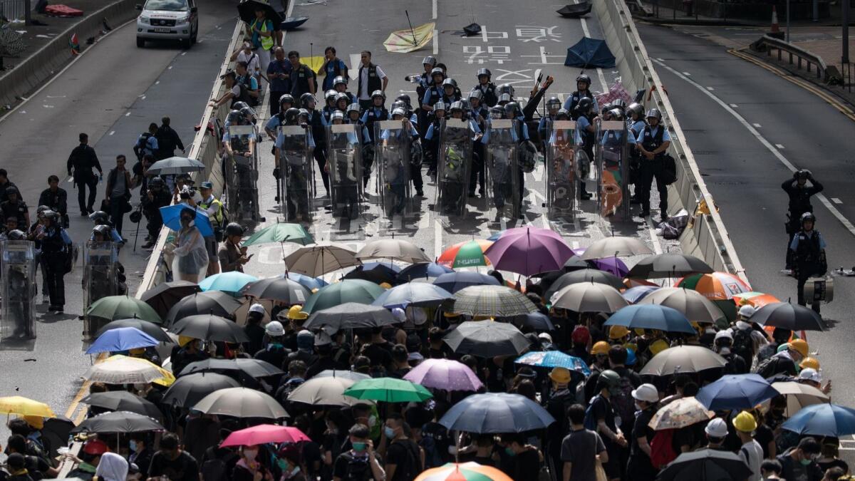 Protesters face off with police on a blocked road next to Hong Kong’s legislative complex on July 2, 2019.