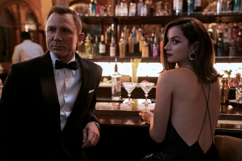 James Bond (Daniel Craig) and Paloma (Ana de Armas) in NO TIME TO DIE, an EON Productions and Metro-Goldwyn-Mayer Studios film Credit: Nicola Dove