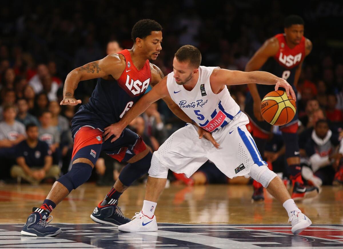 Derrick Rose guards Puerto Rico's J.J. Berea during the second half of an exhibition game in New York. The U.S. national team beat to Puerto Rico, 112-86.