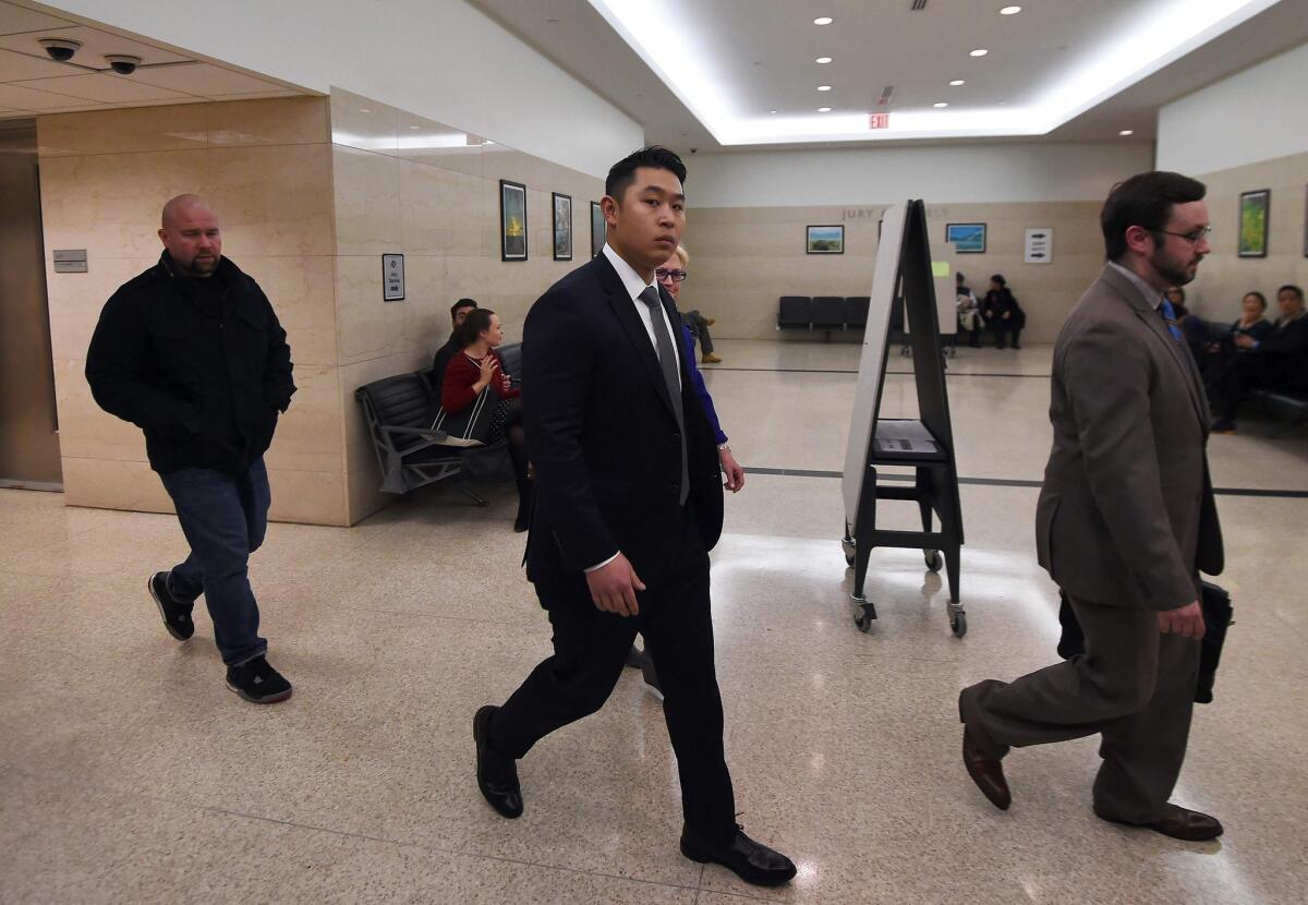 Officer Peter Liang arrives at court in Brooklyn, N.Y.