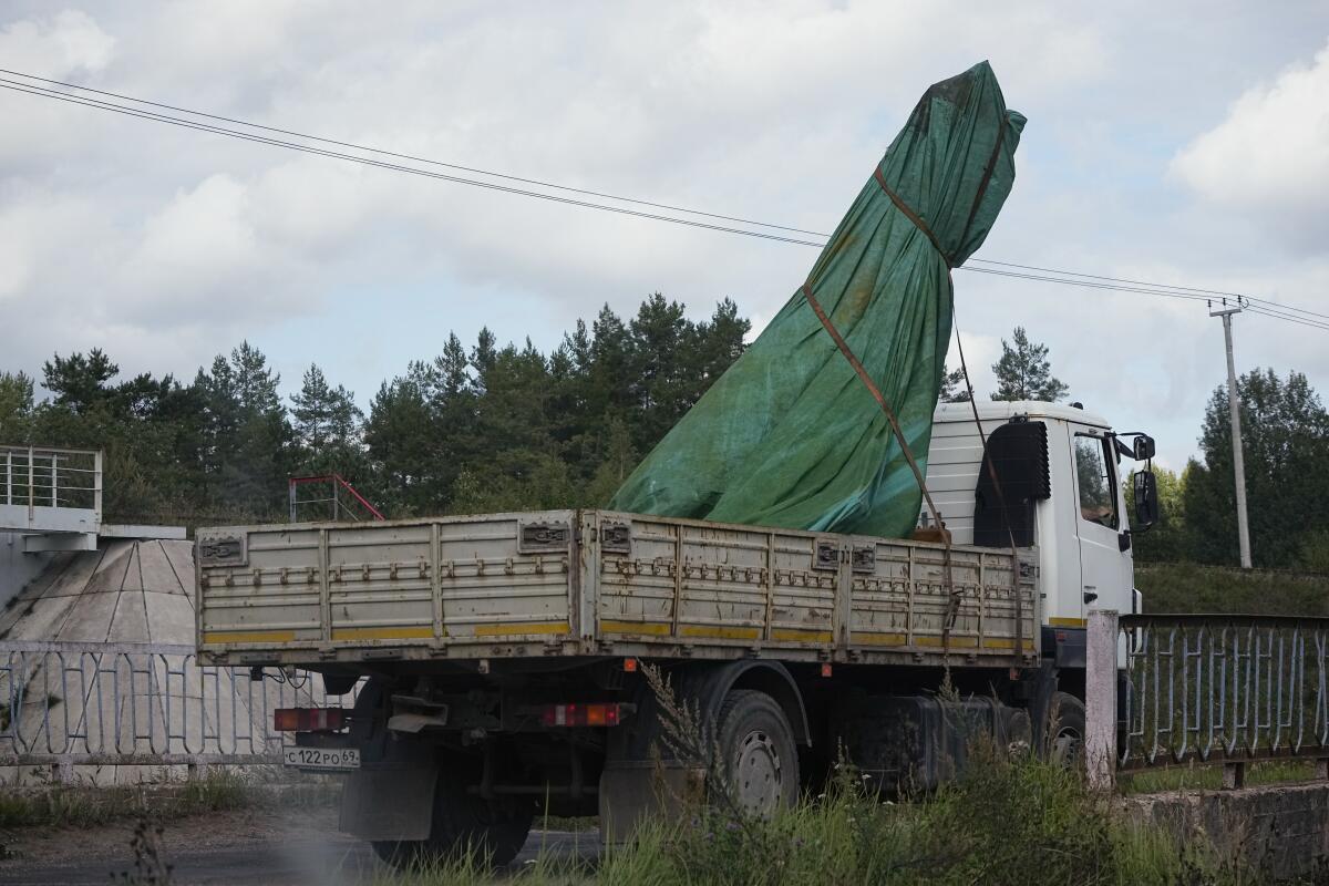Truck carrying wreckage from plane crash