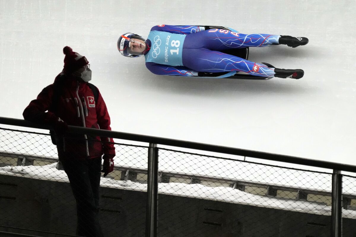 Emily Sweeney of the United States speeds down the track during a women's luge training session at the 2022 Winter Olympics, Thursday, Feb. 3, 2022, in the Yanqing district of Beijing. (AP Photo/Mark Schiefelbein)