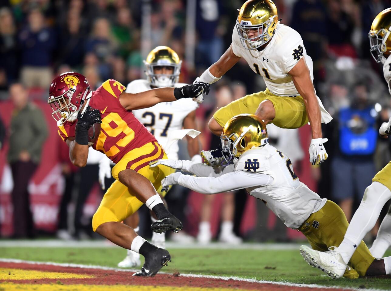 USC running back Vavae Malepeai scores a touchdown against the Notre Dame defense in the first quarter at the Coliseum Saturday.