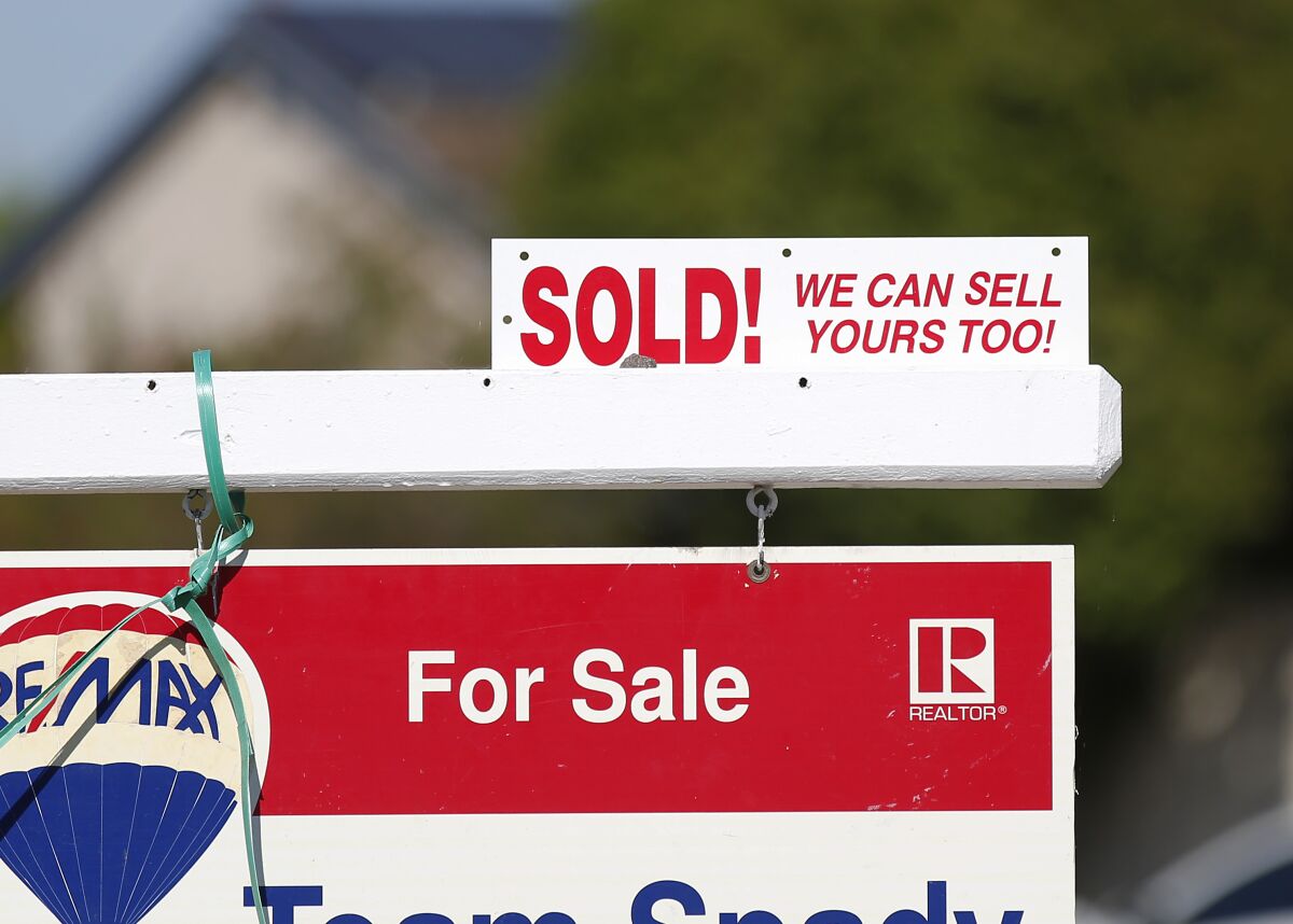 A sold sign is displayed outside of a Clairemont home.