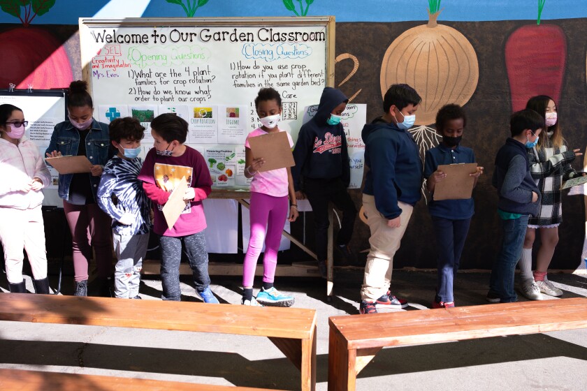 Jessica Eves teachers her students about organic gardening at Darnall Charter School on Feb. 17, 2022 in San Diego. 