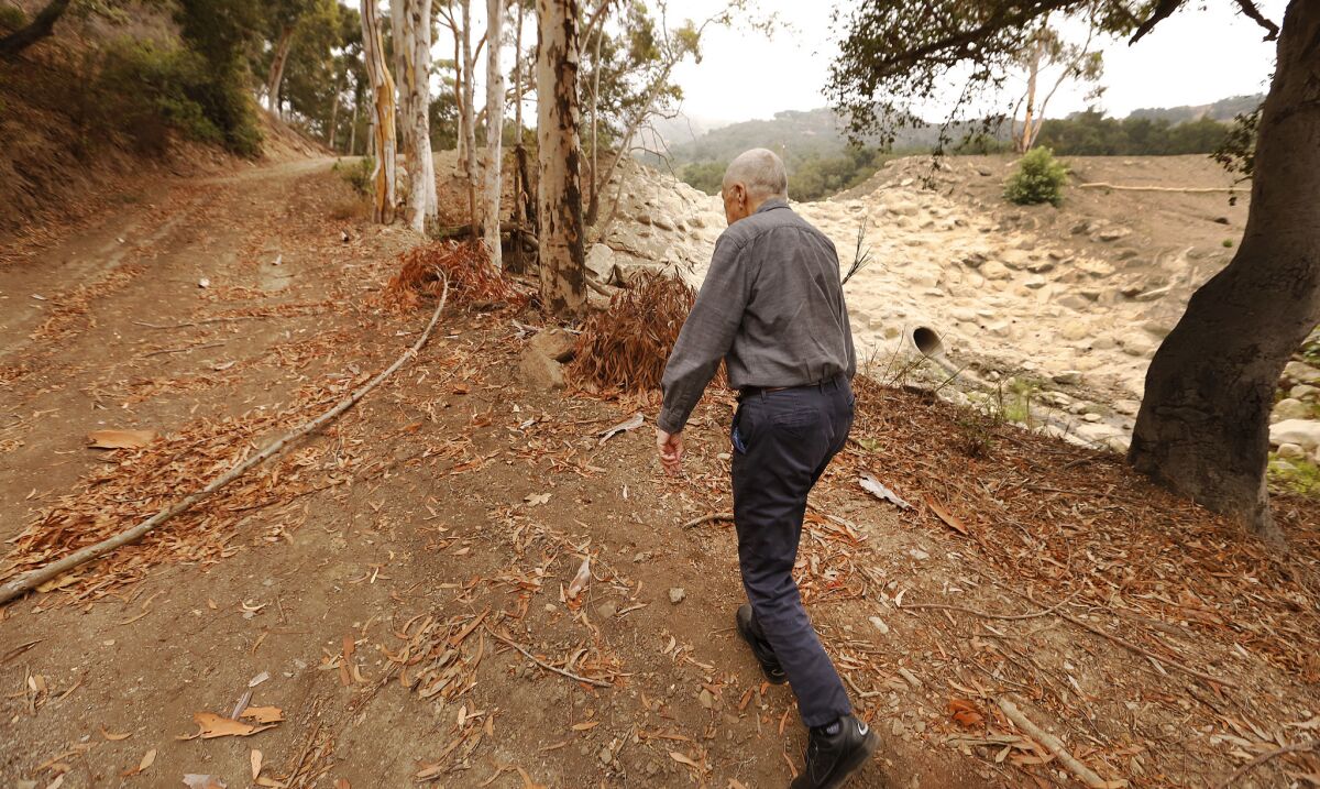 MONTECITO, CA - SEPTEMBER 10, 2018 Jim Stubchaer, 88, former San Barbara County flood control district chief, at Romero Canyon Creek Number 18 Debris Basin Dam in the hills of Montecito on September 10, 2018. (Al Seib / Los Angeles Times)