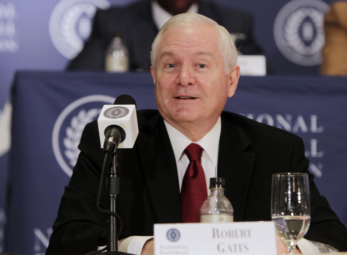 Former U.S. Secretary of Defense Robert Gates, seen here during a 2011 news conference, said May 23 that he would have supported allowing gay adults to be Scoutmasters.