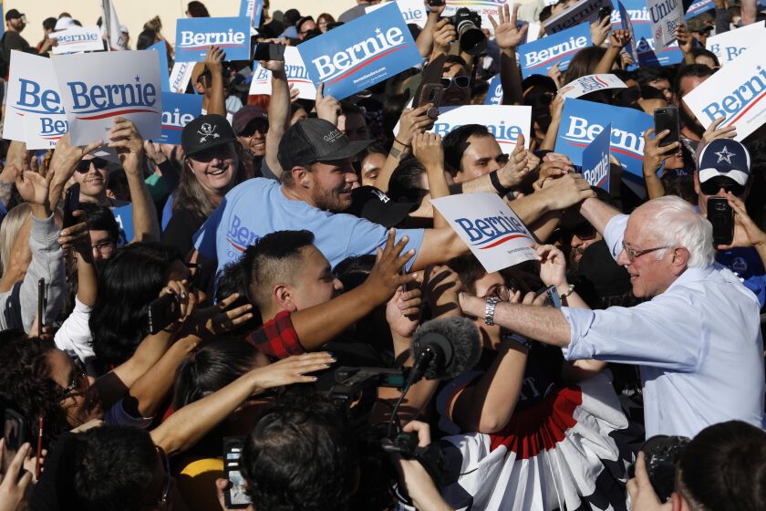 LOS ANGELES, CA - NOVEMBER 16, 2019 - Senator Bernie Sanders greets supporters at the end of his 2020 Rally at Woodrow Wilson Senior High School in Los Angeles on November 16, 2019. Sanders campaign is heavily investing in California and it sees Latino voters as the path to winning to the nomination. (Genaro Molina / Los Angeles Times)