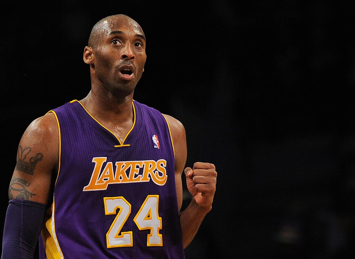 Los Angeles Lakers Kobe Bryant reacts while playing against the Brooklyn Nets during their NBA game at the Barclays Center in the Brooklyn borough of New York City, February 5, 2013.