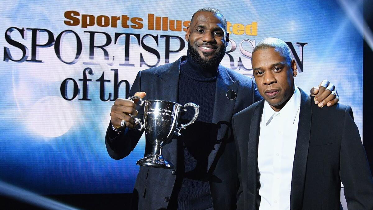 LeBron James, left, stands with Jay Z during the Sports Illustrated Sportsperson of the Year ceremony at Barclays Center on Dec. 12.