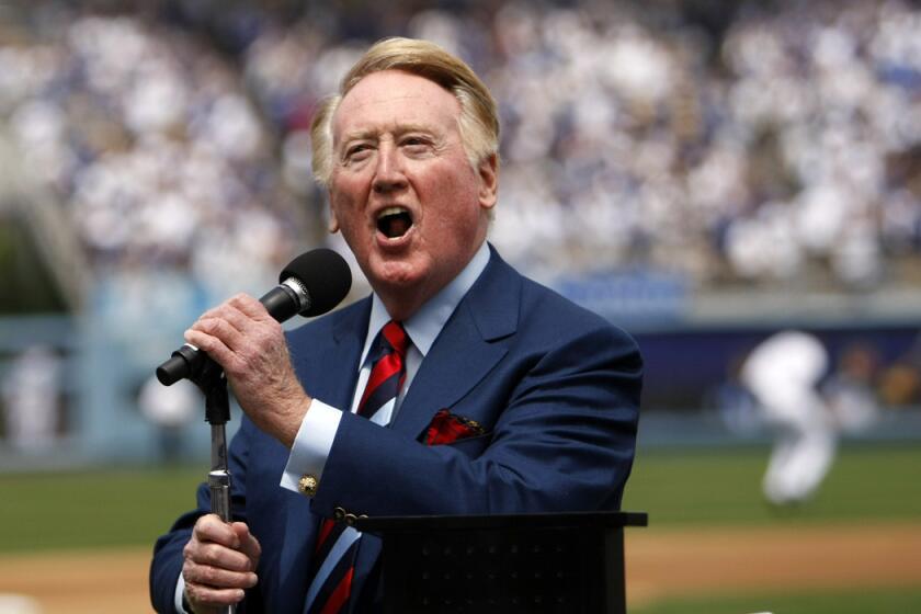 Vin Scully announces, "It's time for Dodgers baseball," before the team's season opener against the San Francisco Giants in April 2009.