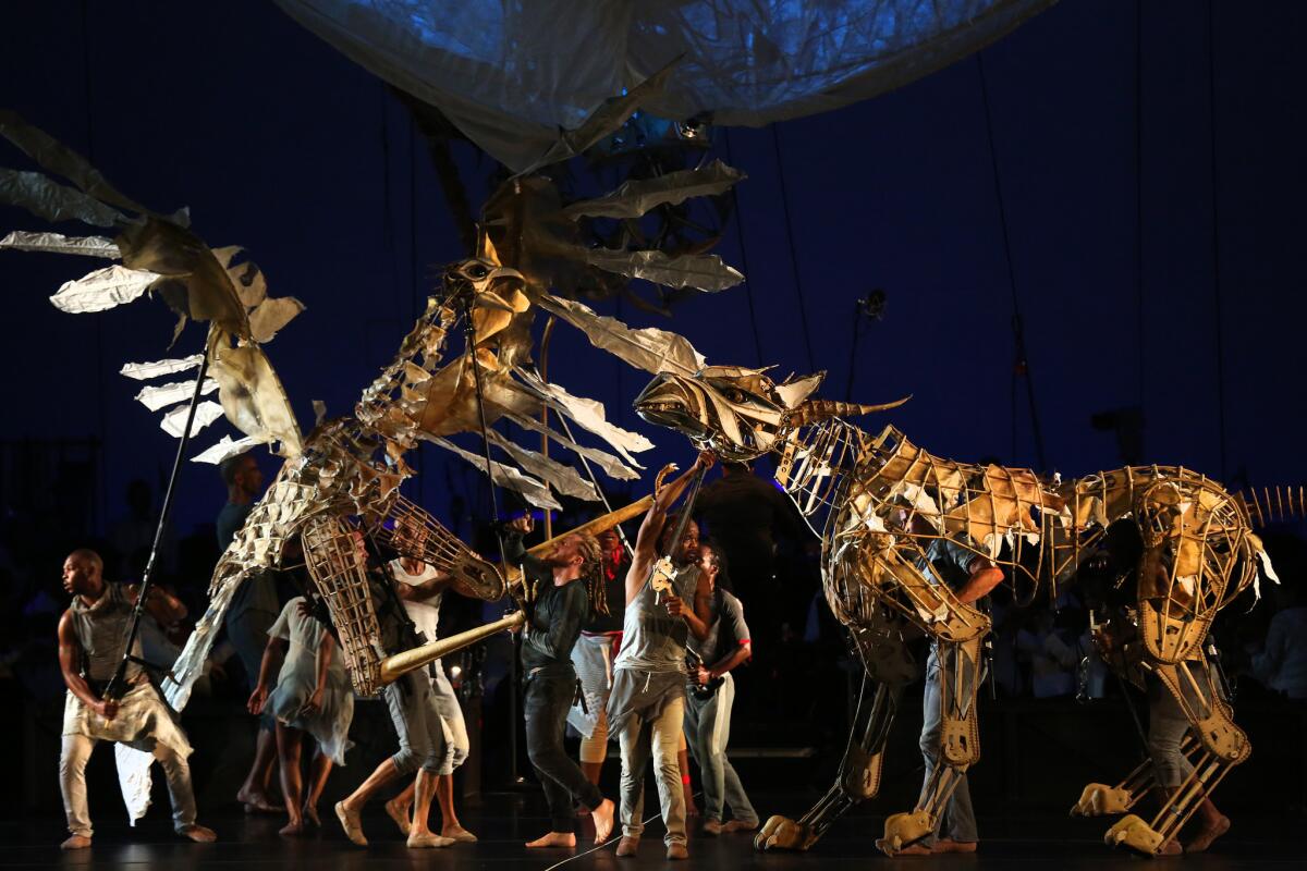 Pole-operated puppets provide the backdrop to Stravinsky.