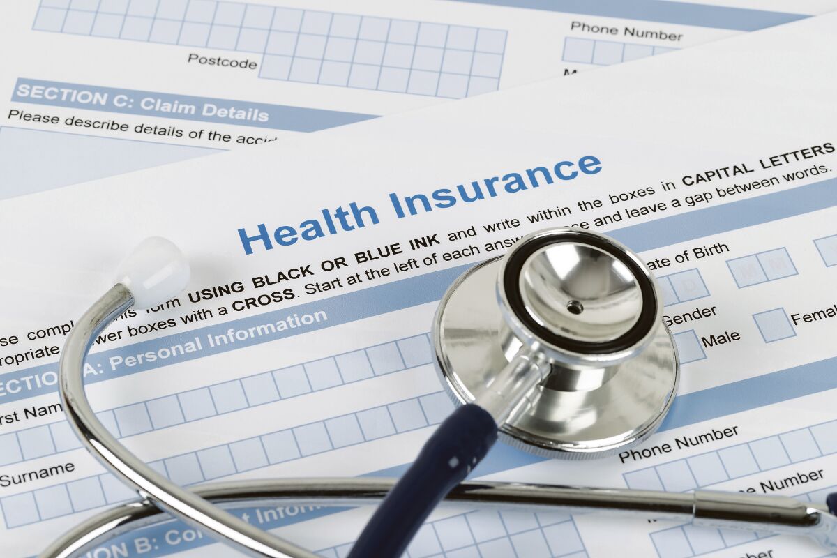 A health insurance form and a stethoscope