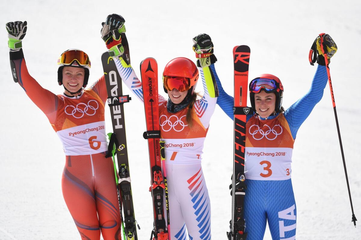 Giant slalom medal winners Ragnhild Mowinckel of Norway, Mikaela Shiffrin of the U.S. and Federica Brignone of Italy pose for a photo..