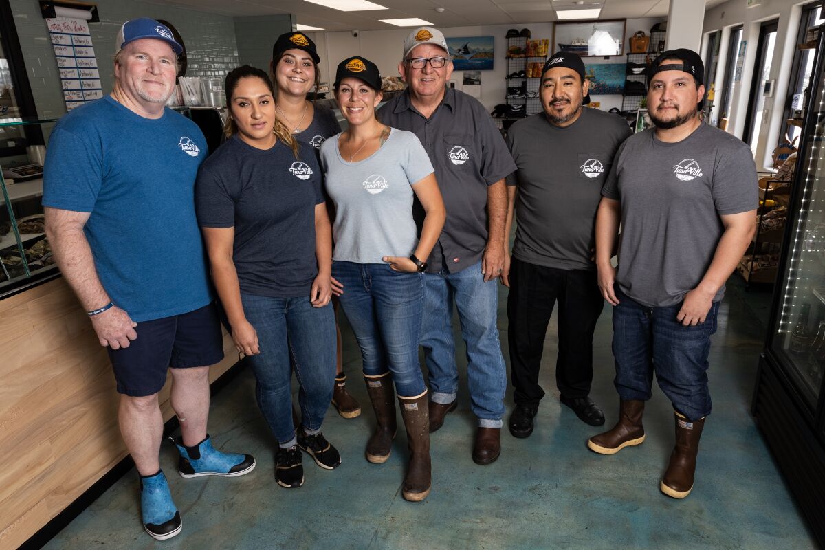 Tommy Gomes (third from right) with his crew at TunaVille Market and Grocery.