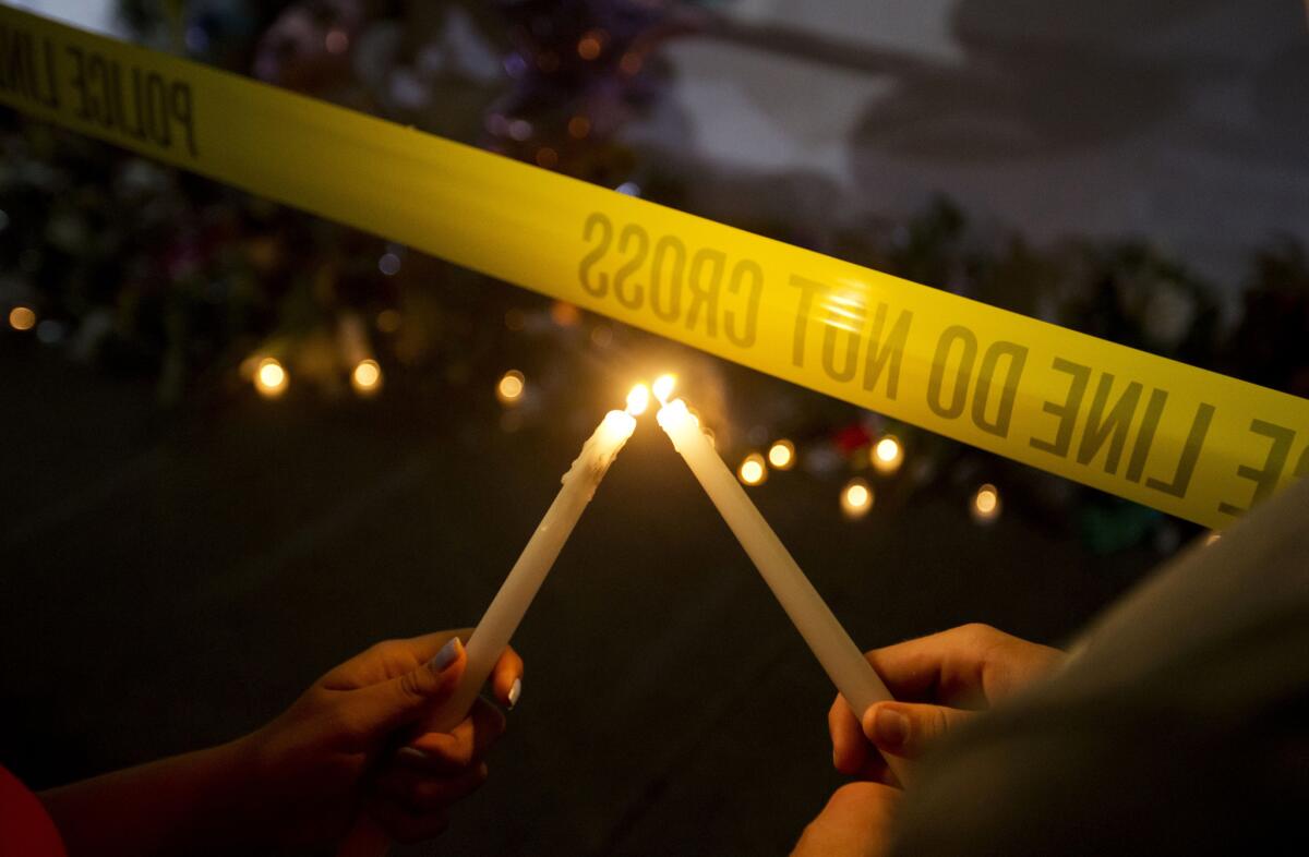 A candlelight vigil is held outside Emanuel AME Church in Charleston, S.C., where nine people were slain during Bible study a night earlier at the historic black church.