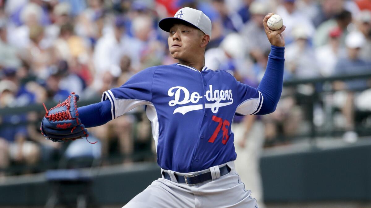 Dodgers starter Julio Urias delivers a pitch during an exhibition game against the Chicago Cubs on Wednesday.
