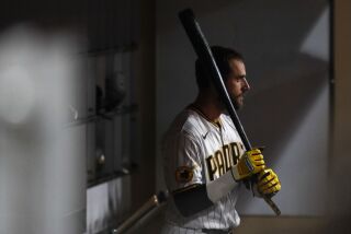 San Diego, CA - May 16: Padres catcher Austin Nola (26) stands with a bat in the dugout during the eighth inning against the Royals at Petco Park on Tuesday, May 16, 2023 in San Diego, CA. (Meg McLaughlin / The San Diego Union-Tribune)