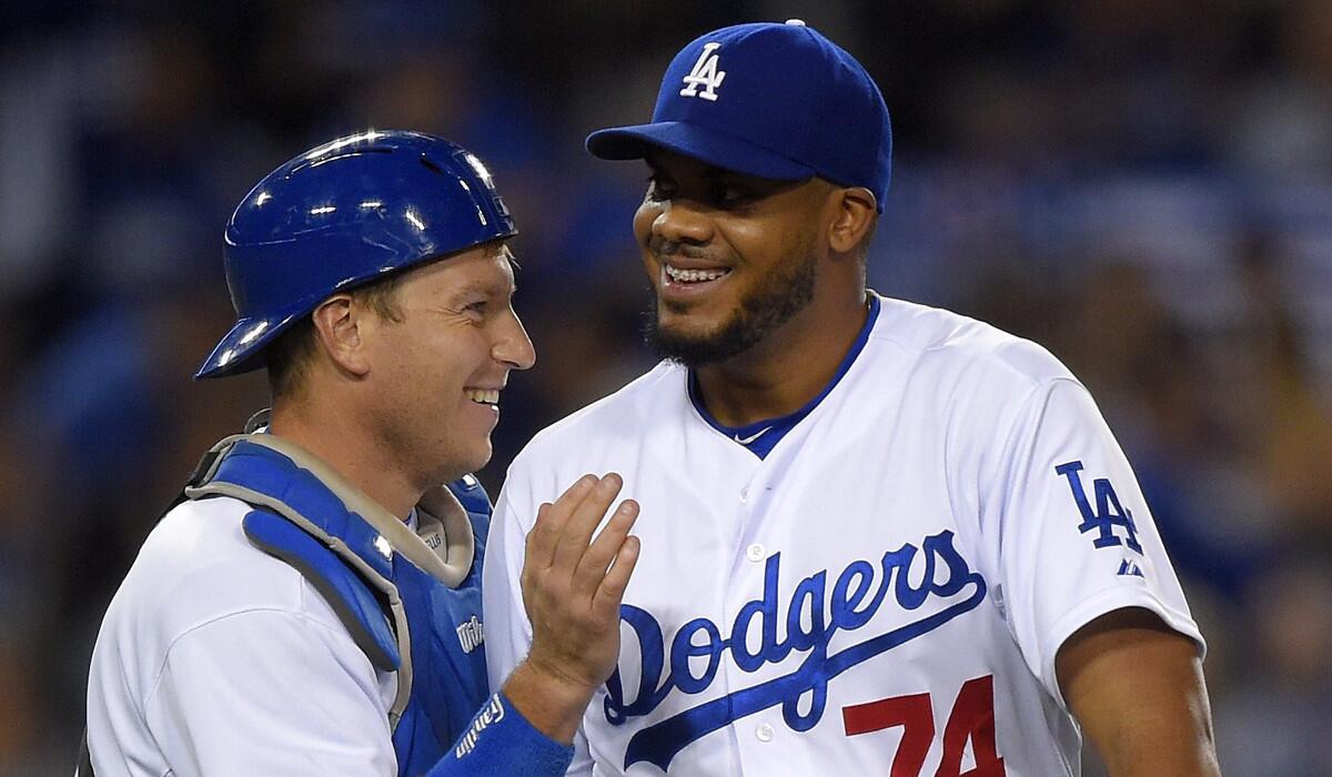 Closer Kenley Jansen, right, and catcher A.J. Ellis celebrate after the Dodgers' 2-0 victory over St. Louis on June 6.