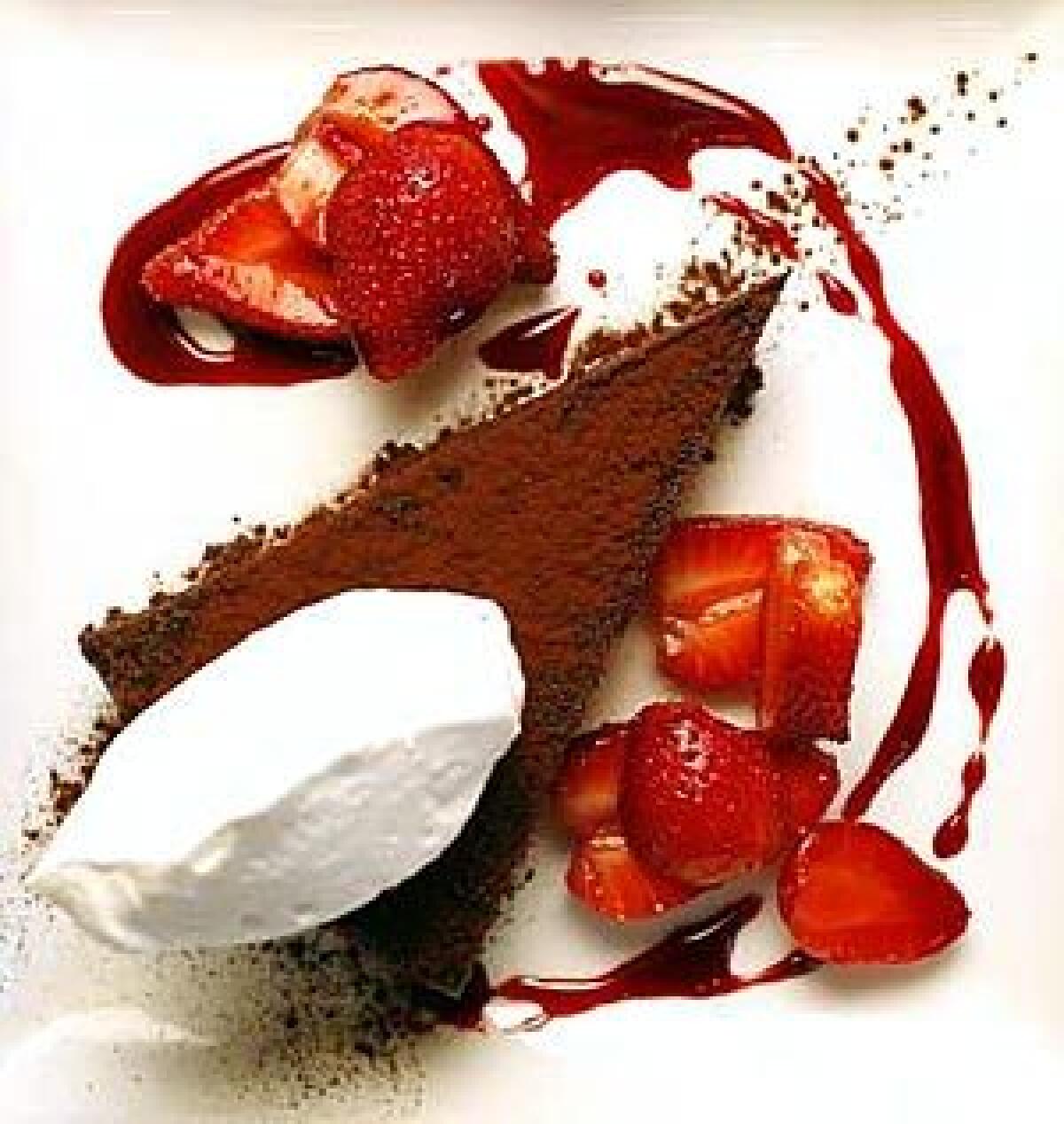 CELEBRATE: Elegant flourless chocolate cake is topped with Zinfandel-macerated local strawberries and kosher whipped nondairy cream.