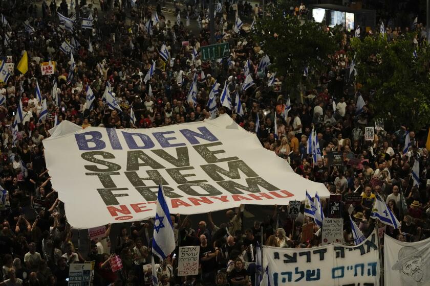 People protest against Israeli Prime Minister Benjamin Netanyahu's government and call for the release of hostages held in the Gaza Strip by the Hamas militant group in Tel Aviv, Israel, Saturday, June 1, 2024. (AP Photo/Maya Alleruzzo)