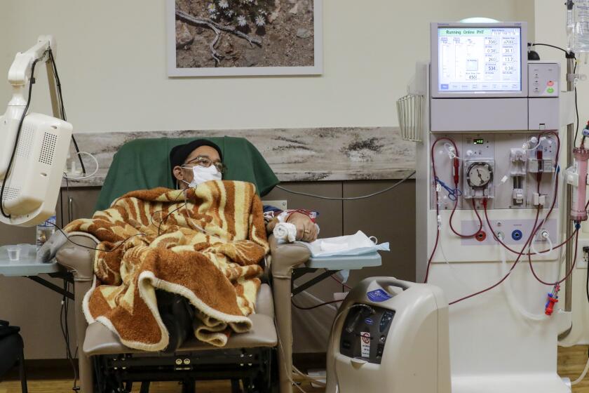VICTORVILLE, CA - APRIL 25: Rue Arnwine Jr., a COVID-19 patient gets dialysis at Desert Cities Dialysis in Victorville, CA. (Irfan Khan / Los Angeles Times)