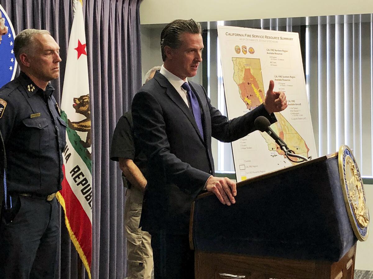 Gov. Gavin Newsom talks with reporters in Los Angeles on Oct. 24, 2019.