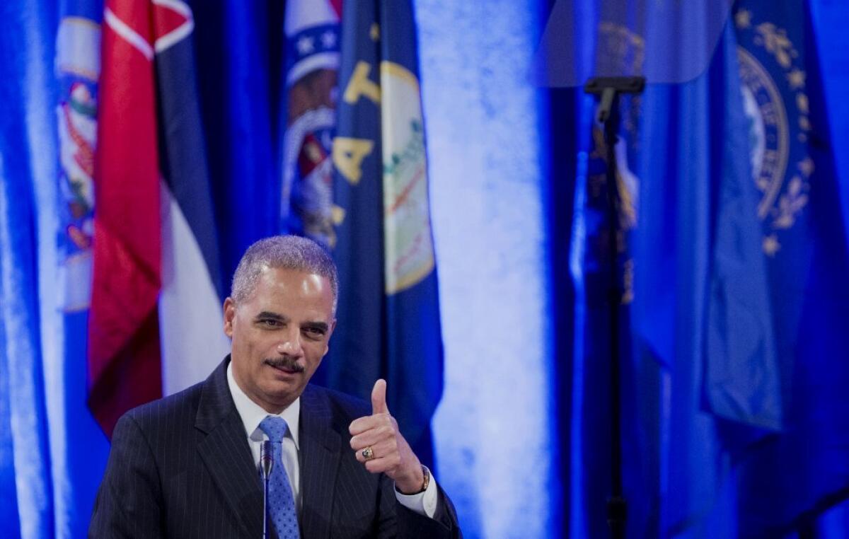 U.S. Atty. Gen. Eric H. Holder Jr. speaks Tuesday at a meeting of the National Assn. of Attorneys General in Washington.