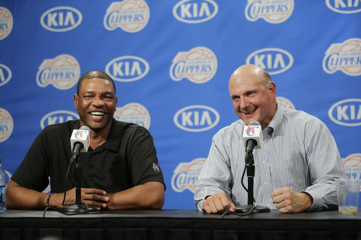 Clippers Coach Doc Rivers with team owner Steve Ballmer.