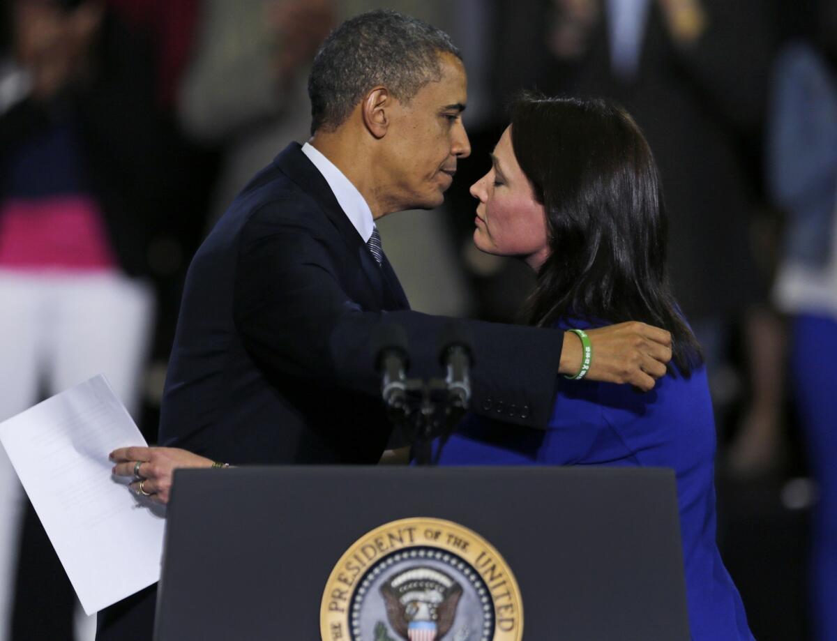 President Obama embraces Nicole Hockley, whose 6-year-old son, Dylan, was killed in the Newtown, Conn., school shootings. Obama had invited her to speak at a rally in Hartford, Conn., to urge Congress to pass stricter gun control laws.