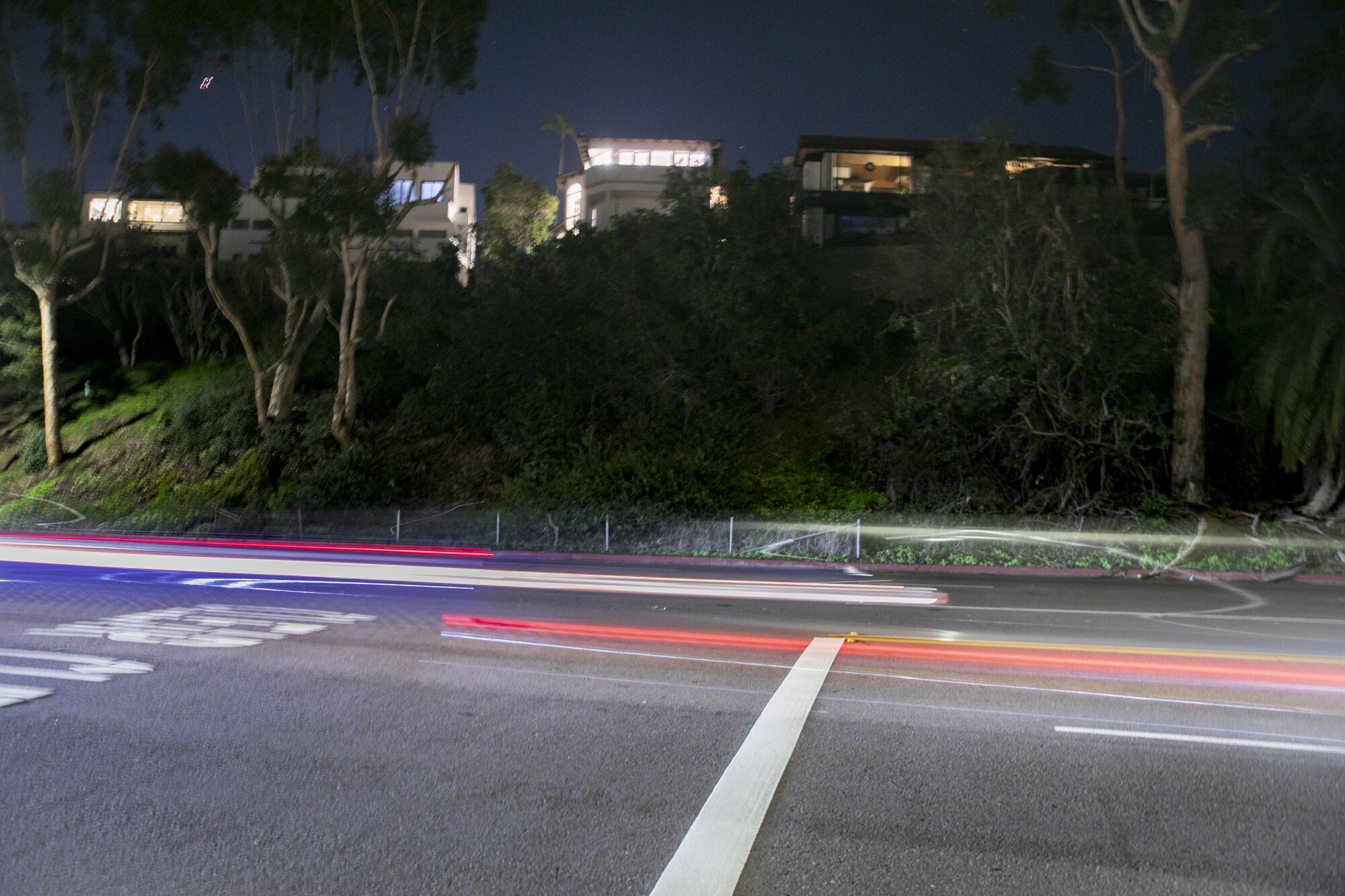 Cars drive down Torrey Pines Road, as seen from Hillside Drive in the La Jolla neighborhood