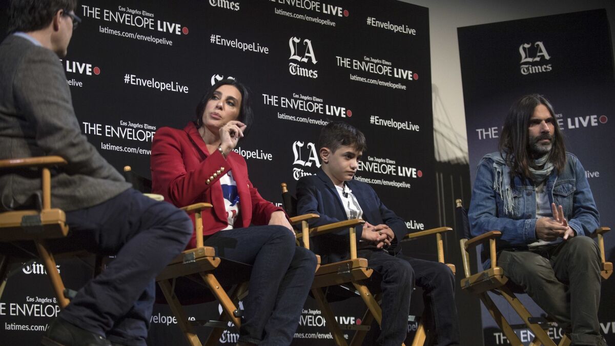 LA Times reporter Mark Olsen, from left , discusses "Capernaum" with director Nadine Labaki, actor Zain Al Rafeea and producer Khaled Mouzanar at an Envelope Live screening at the Montalban.