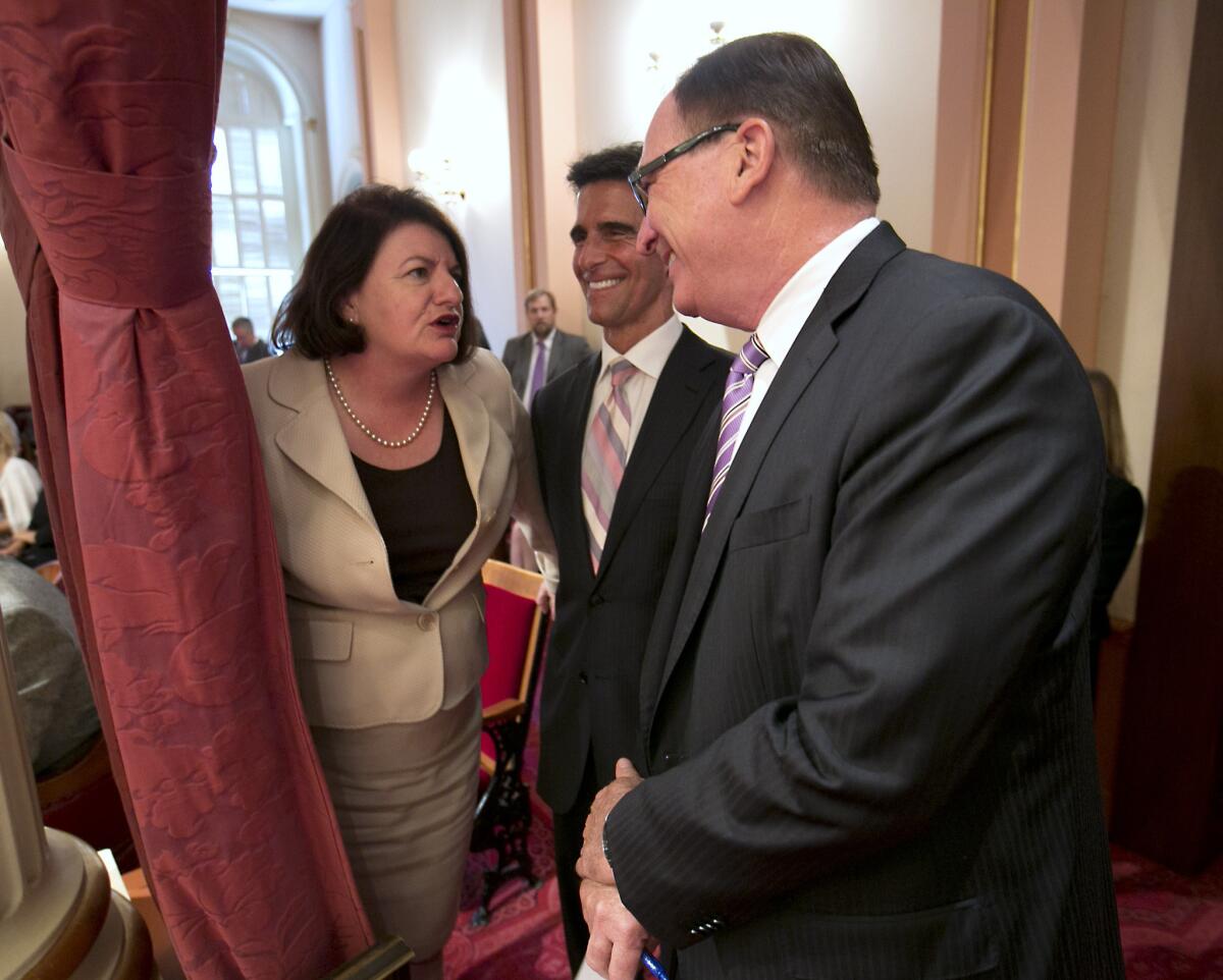 \Assembly Speaker Toni Atkins, D-San Diego, confers with Senate Budget Committee Chairman Mark Leno, D-San Francisco, center, and Senate Minority Leader Bob Huff, R-Diamond Bar, right, as the state budget was debated in the Senate in Sacramento, Calif., Sunday, June 15, 2014.