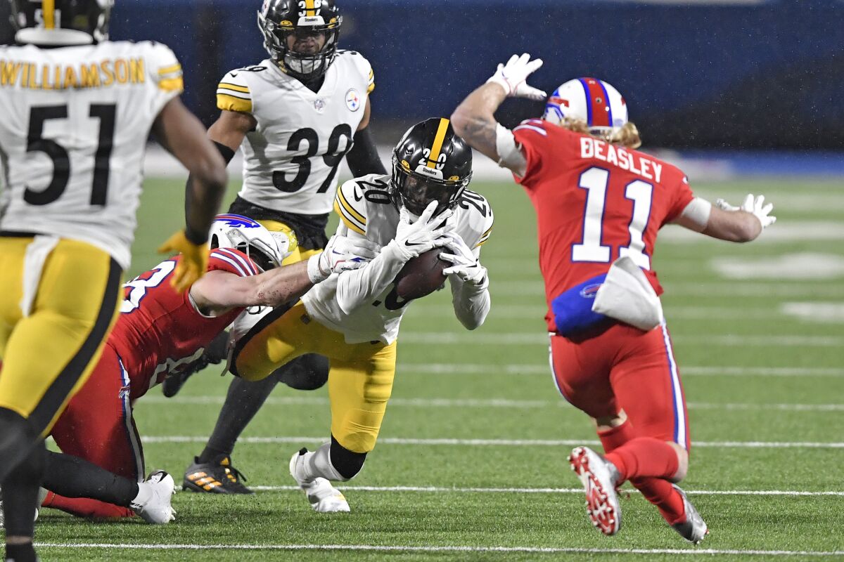 Pittsburgh Steelers cornerback Cameron Sutton (20) intercepts a pass during the first half of an NFL football game against the Buffalo Bills in Orchard Park, N.Y., Sunday, Dec. 13, 2020. (AP Photo/Adrian Kraus)